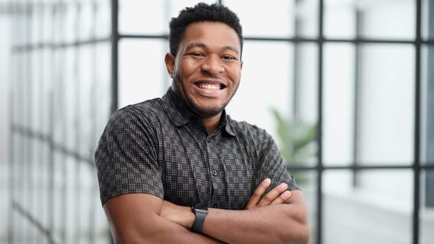Handsome cheerful african american executive business man at the workspace office