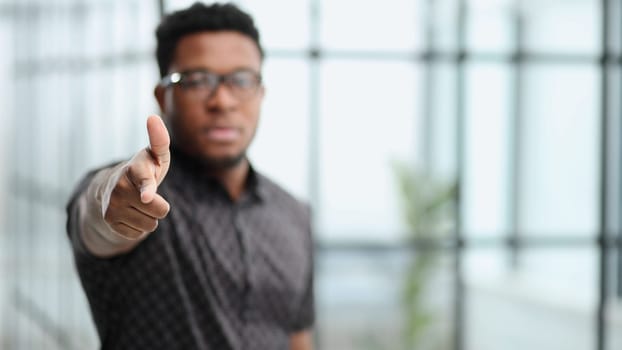 You won't get away with it. Portrait of a businessman pointing his finger to you
