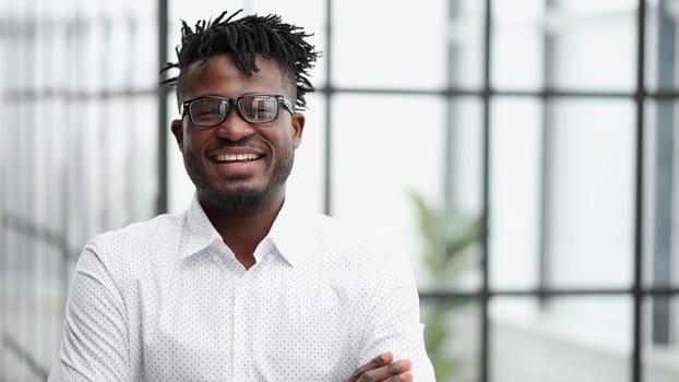 Portrait of a smiling businessman with arms crossed