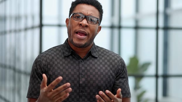 People and lifestyle. Indoor shot of a young confident black businessman looking serious