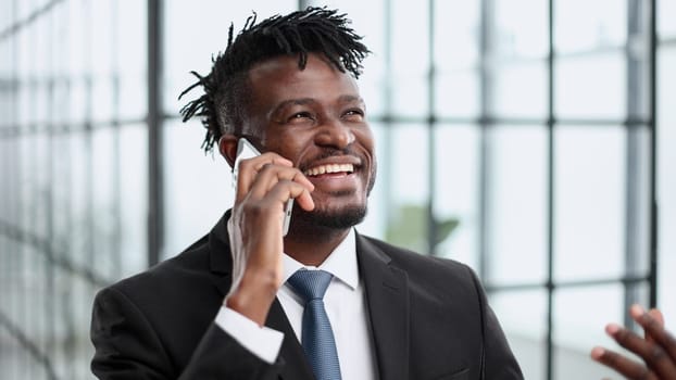 businessman in a suit talking on the phone in the office