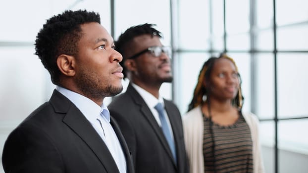 dreamy black employee thinking about business success, making plans. Business vision concept
