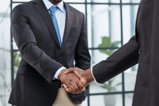 young black businessman shaking hands in the office
