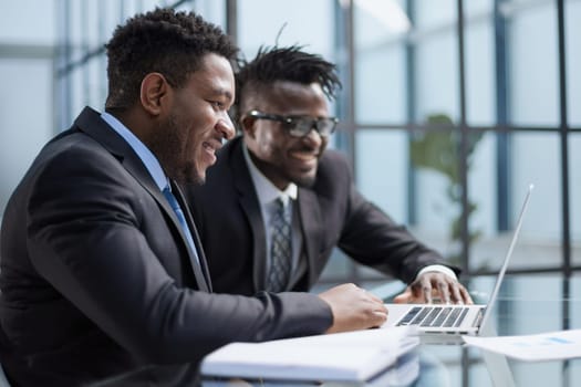 African american boss negotiating discussing contract details with company corporate client.