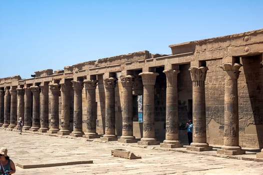 Aswan, Egypt - April 17 2008: Tourists visiting the Philae temple near the Aswan dam on the Nile. Egypt