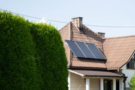 Historic farm house with modern solar panels on roof and wall High quality photo