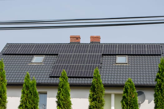 Historic farm house with modern solar panels on roof and wall High quality photo