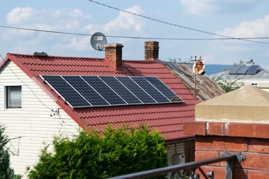 Historic farm house with modern solar panels on roof and wall High quality photo