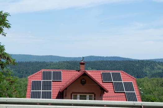 Historic farm house with modern solar panels on roof and wall High quality photo