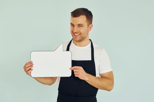 Sincere emotions. Man standing in the studio with empty signs for the text.