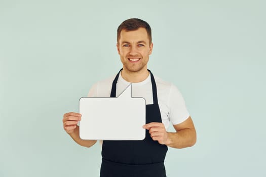 Sincere emotions. Man standing in the studio with empty signs for the text.
