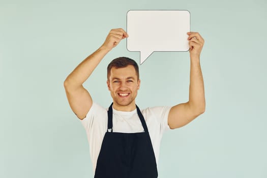 Sincere emotions. Man standing in the studio with empty signs for the text.