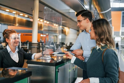 Professional service. Young couple is in the airport together.
