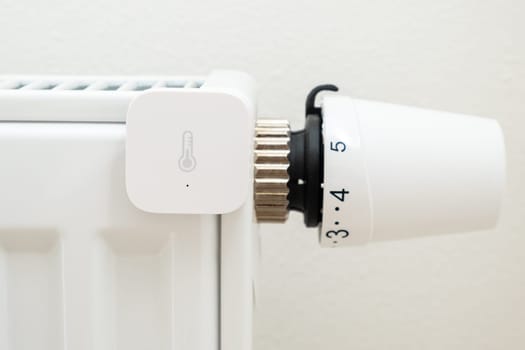 Smart heat sensor on the battery for temperature control. The increasing price of gas and heating concept