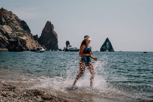 Fitness woman sea. Outdoor workout on yoga mat in park near to ocean beach. Female fitness pilates yoga routine concept. Healthy lifestyle. Happy fit woman exercising with rubber band in park.