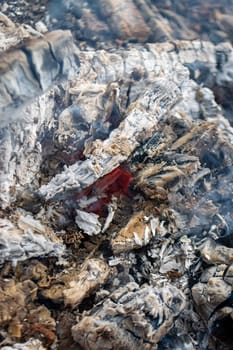 A piece of broken glass with smoke coming out of it. High quality photo