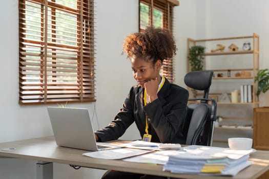 Accountant black woman working on laptop and do document, tax, exchange, accounting and Financial advisor concept.