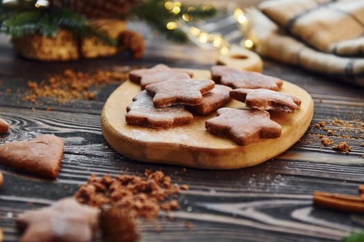 Cookies laying down on the table. Christmas background with holiday decoration.