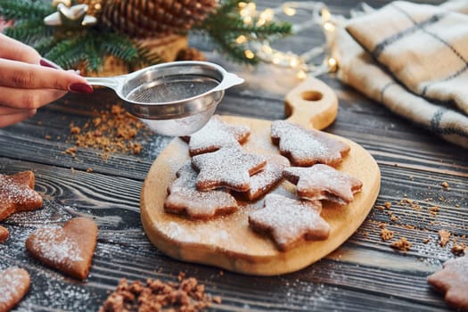 Cookies laying down on the table. Christmas background with holiday decoration.