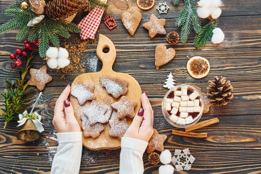 Woman decorating the table. Christmas background.