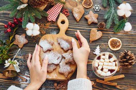 Woman decorating the table. Christmas background.