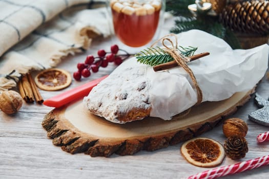 Close up view of stollen. Christmas background with holiday decoration.