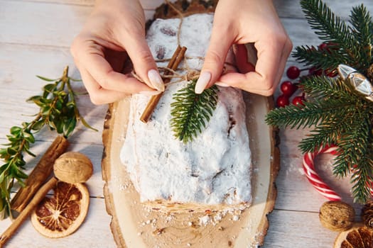 Stollen with holiday decorations. Christmas background.