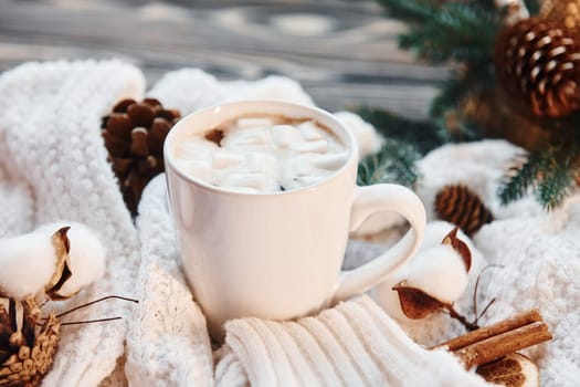 Cup of hot drink. Christmas background with holiday decoration.