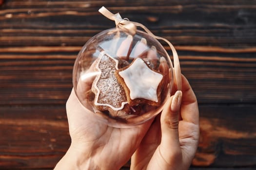 Woman holding sphere object. Christmas background with holiday decoration.