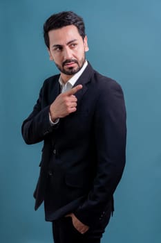 Confident businessman in formal suit pointing finger up to indicate promotion or advertising with excited and amazed facial expression and gesture on isolated background. Fervent