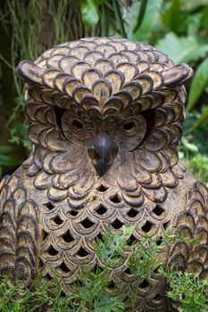  Statue of an owls on nature background. Art