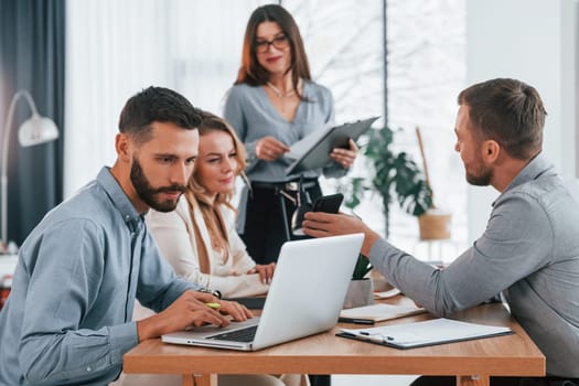 Modern technologies. Group of business people that working on the project in the office.