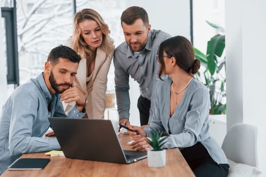 Internet connection by using laptop. Group of business people that working on the project in the office.