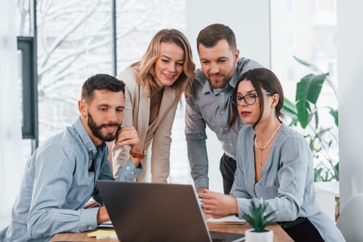 Internet connection by using laptop. Group of business people that working on the project in the office.