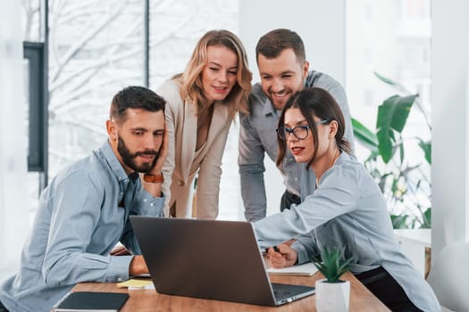 Internet connection by using laptop. Group of business people that working on the project in the office.