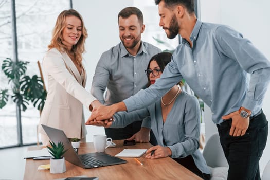 Internet connection by using laptop. Group of business people that working on the project in the office.