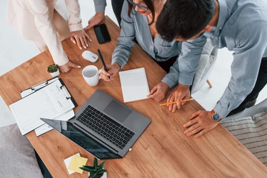 Internet connection by using laptop. Group of business people that working on the project in the office.