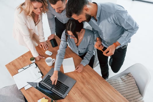 Top view of business people that working by using laptop.