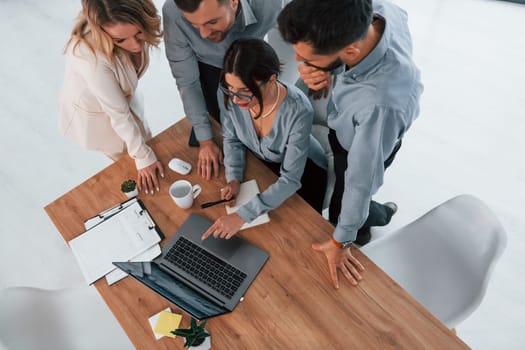 Top view of business people that working by using laptop.