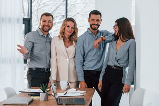 Standing together. Group of business people that working on the project in the office.