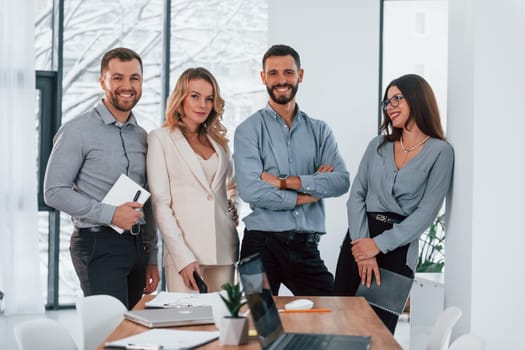 Standing together. Group of business people that working on the project in the office.