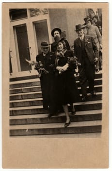 THE CZECHOSLOVAK REPUBLIC - CIRCA 1946: Vintage photo shows people go from wedding ceremony. Retro black and white photography. Circa 1950s.