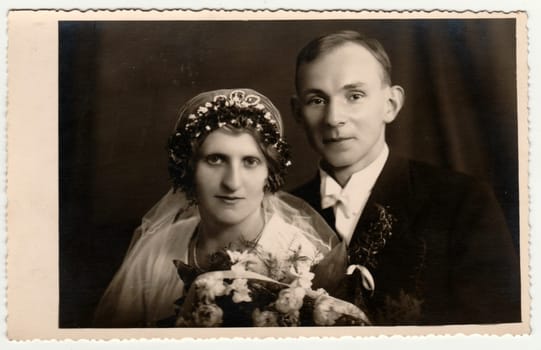 THE CZECHOSLOVAK REPUBLIC - CIRCA 1946: Vintage photo shows newlyweds. Bride wears tiara. Retro black and white photography. Circa 1950s.