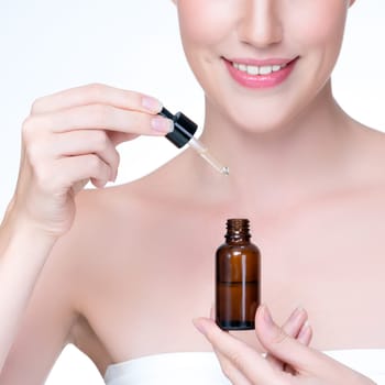 Closeup personable portrait of beautiful woman applying essential oil bottle for skincare product. Cannabis extracted CBD oil dropper for treatment and cannabinoids concept in isolated background.