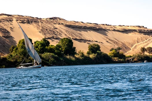 Abu Simbel, Aswan, Egypt - April 18 2008: Feluccas - traditional egyptian boat - on Nile river, Egypt.