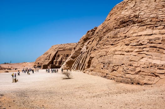 Abu Simbel, Aswan, Egypt - April 18 2008: Tourists visiting the archaeological site of Abu Simbel, Aswan, Egypt