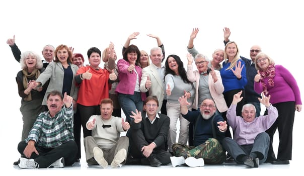 in full growth. groups of happy mature people showing their success.