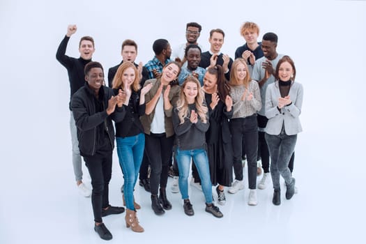 full length . group of happy young people standing together. isolated on a white