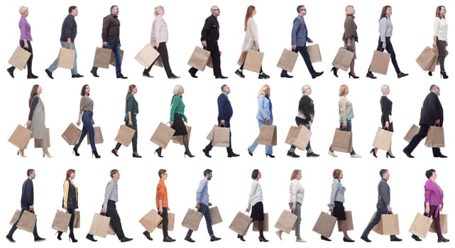 a group of people stand in line with shopping bags. isolated on white