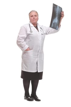 Front view of medical doctor analysing x-ray image looking at camera and smiling